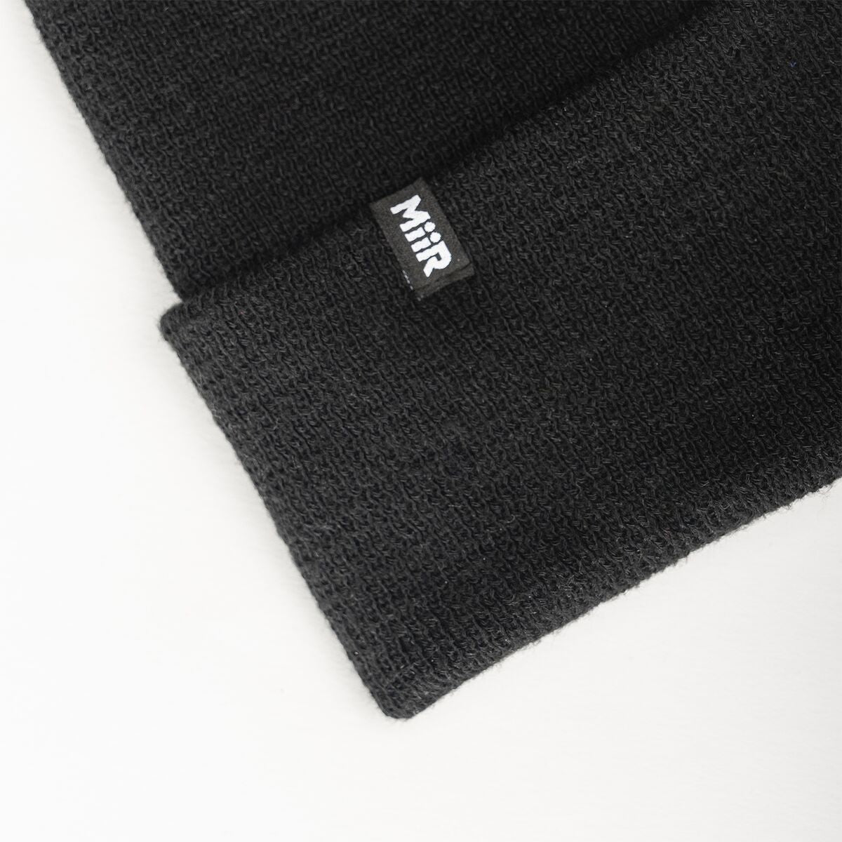 recycled-poly-fine-knit-beanie-o6 WebPDP-RecycledPolyFineKnitBeanie_Studio_TagDetail_Black__BNE005002OS.jpg