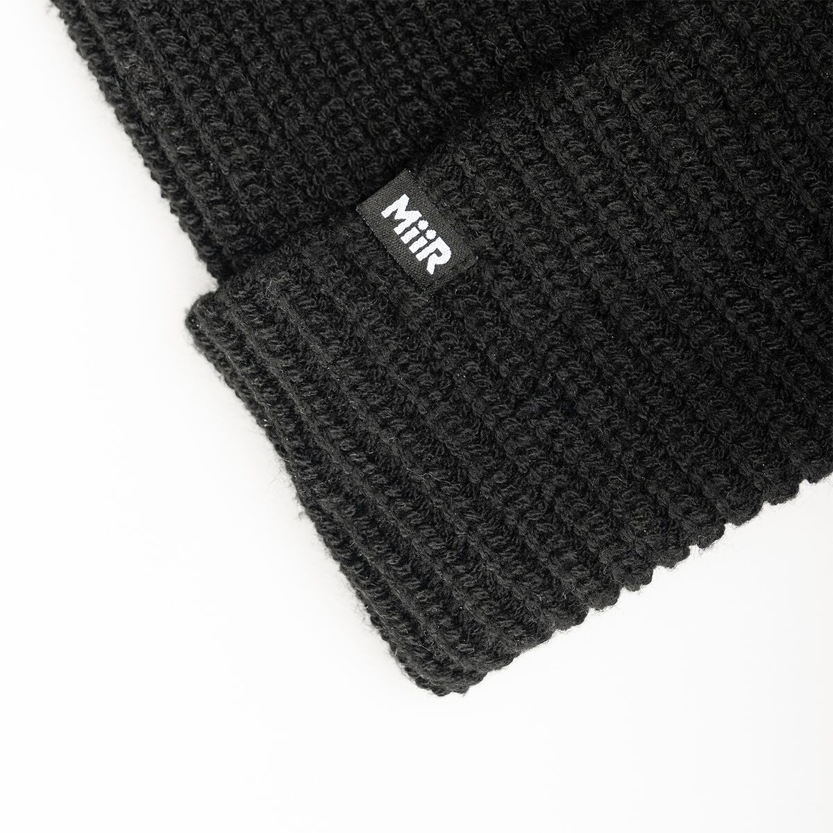 recycled-poly-rib-beanie-s7 WebPDP-RecycledPolyRibBeanie_Studio_TagDetail_Black__BNE002002OS.jpg